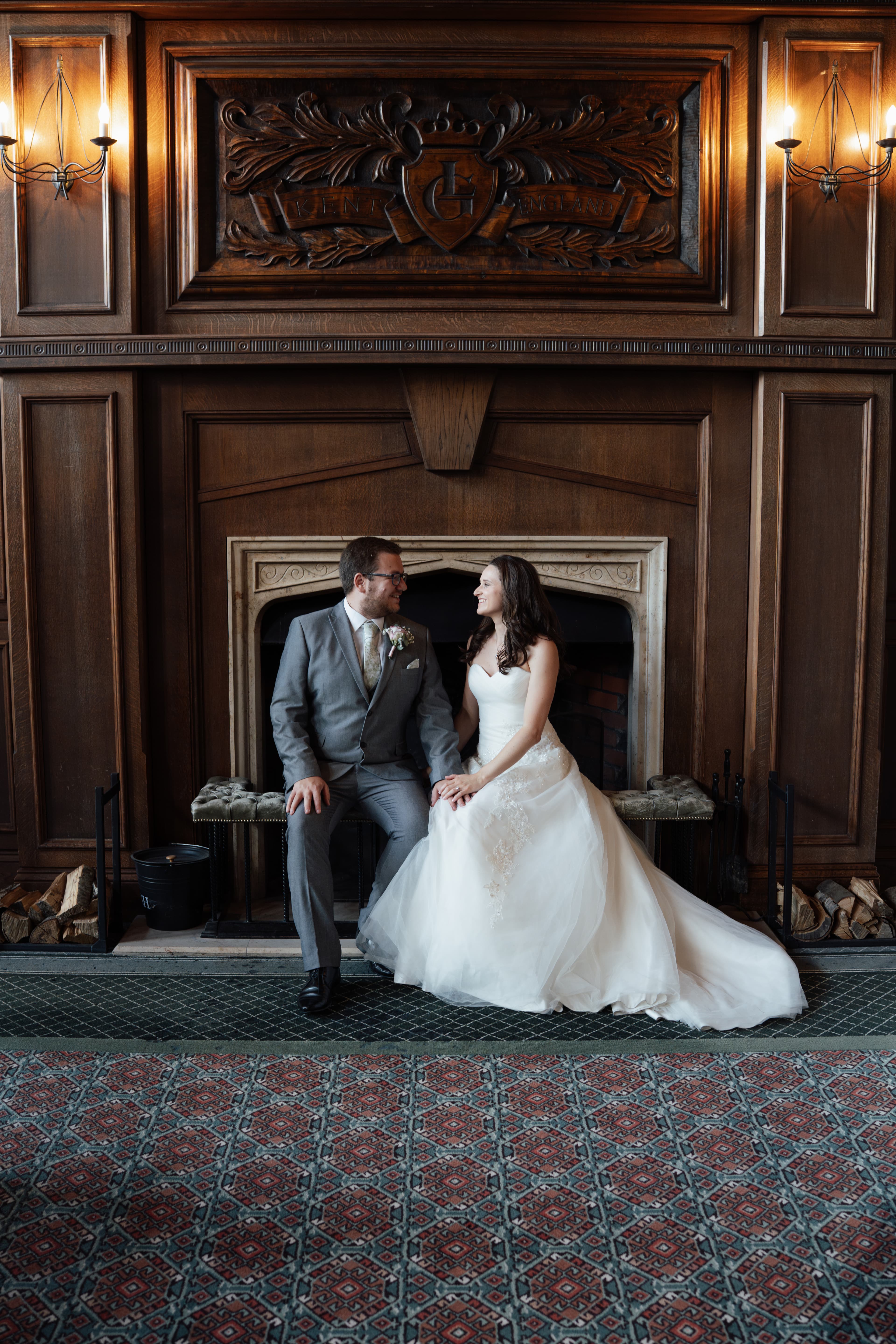 Bride in beautiful dress standing in elegant doorway before wedding ceremony