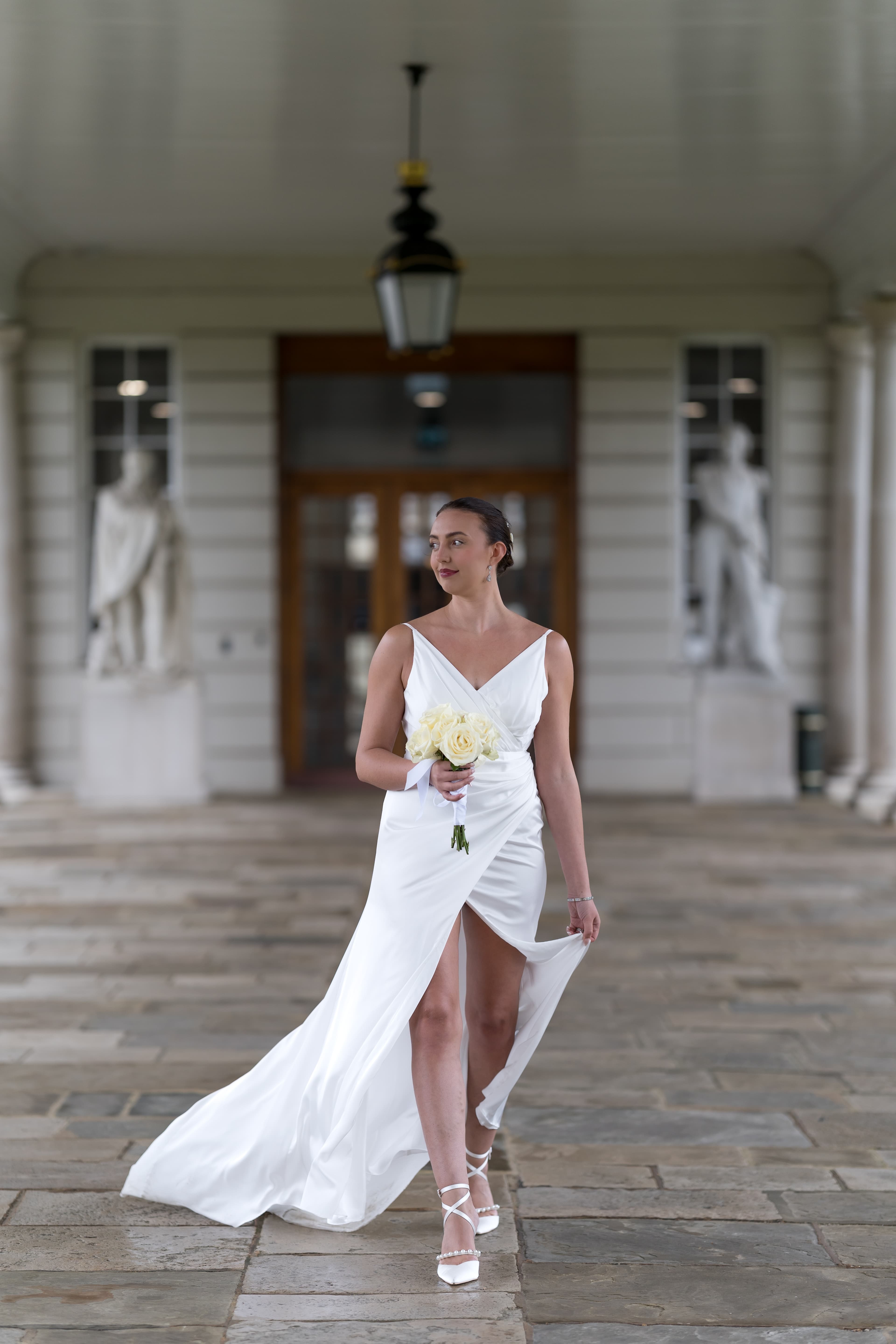 Bride laughing joyfully with wedding bouquet in natural candid moment at Dulwich venue