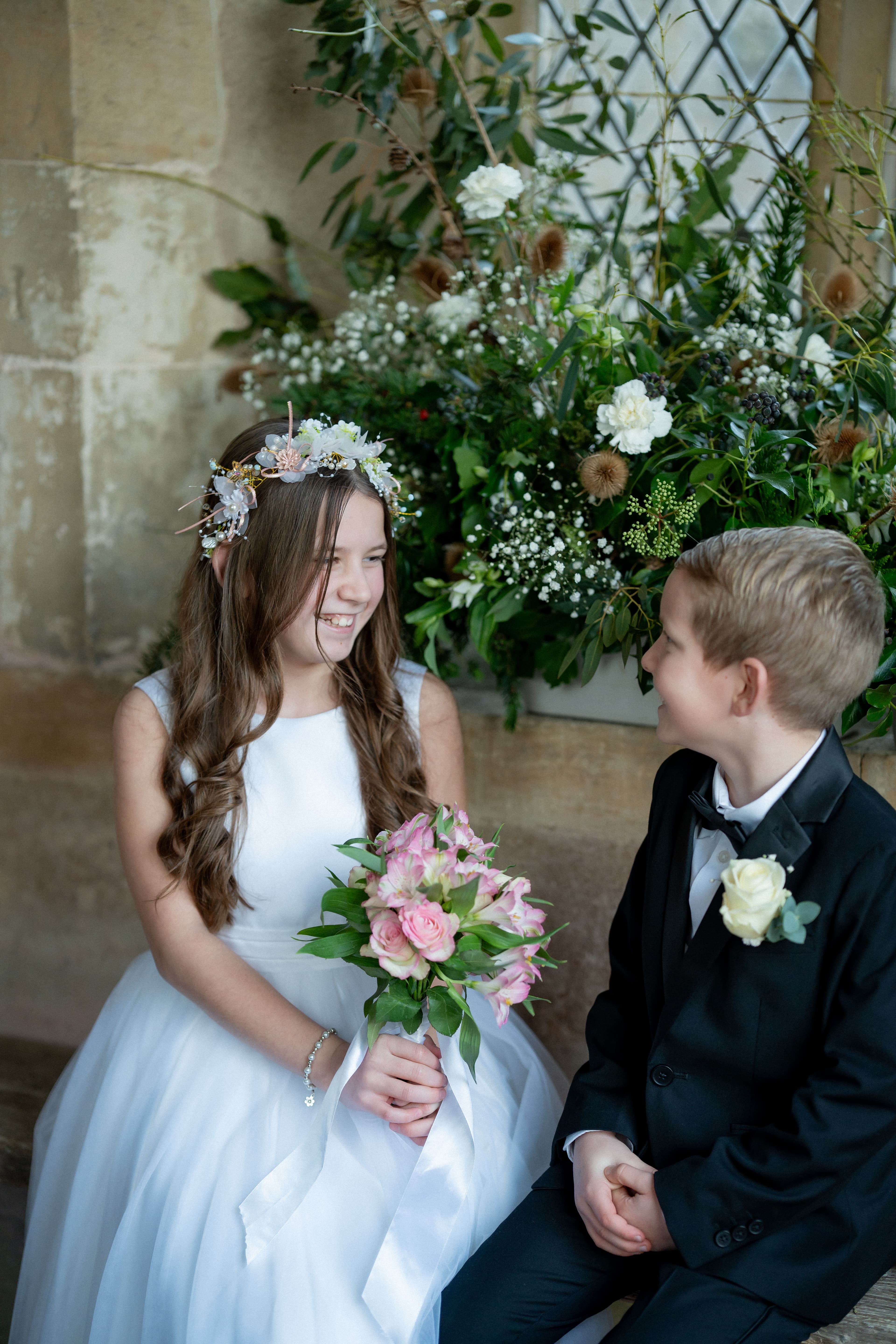 Wedding party standing outside church after ceremony in documentary photography style
