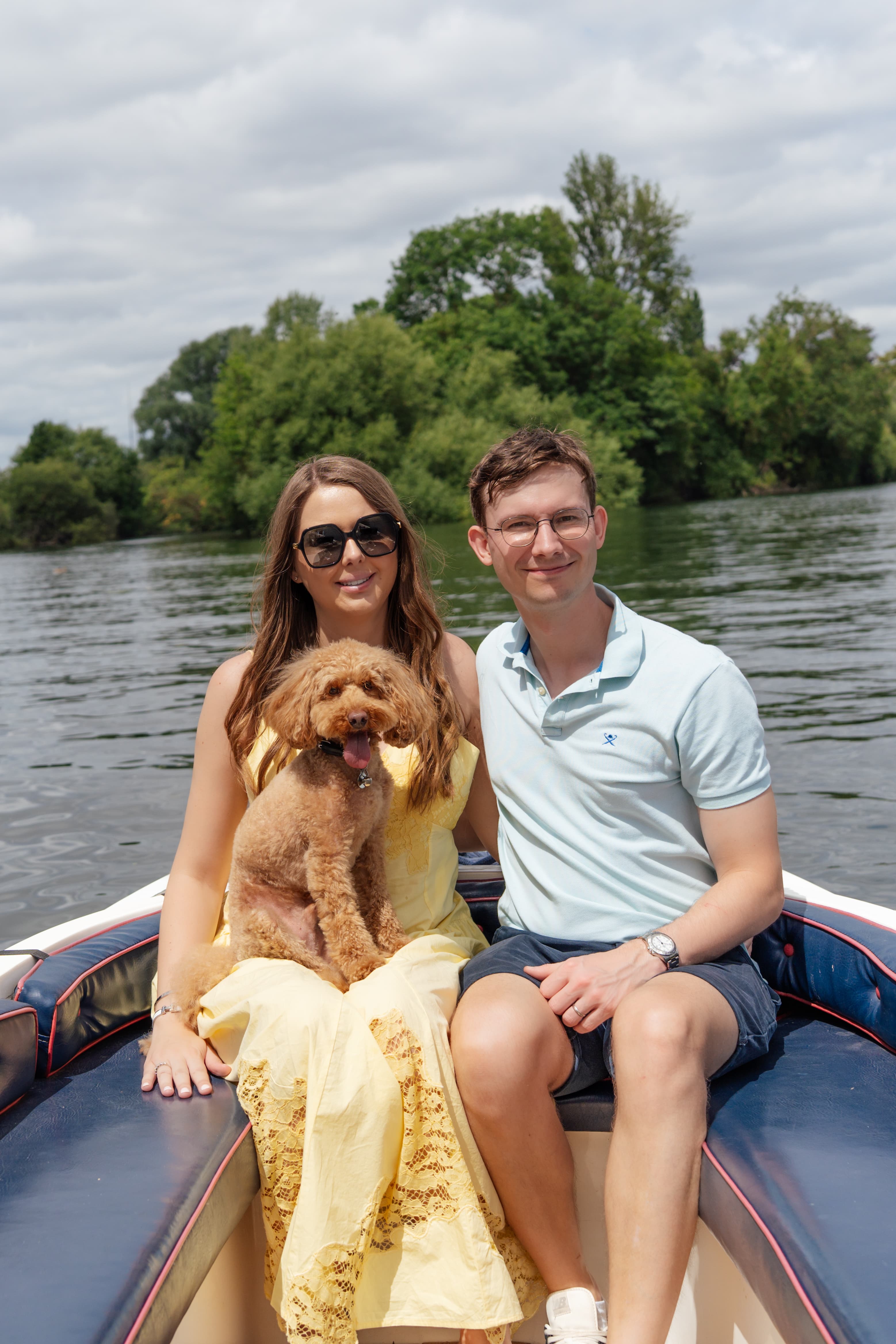 Chloe and Joe Luck photographed together on a boat, showing the husband and wife wedding photography team behind The Lucks