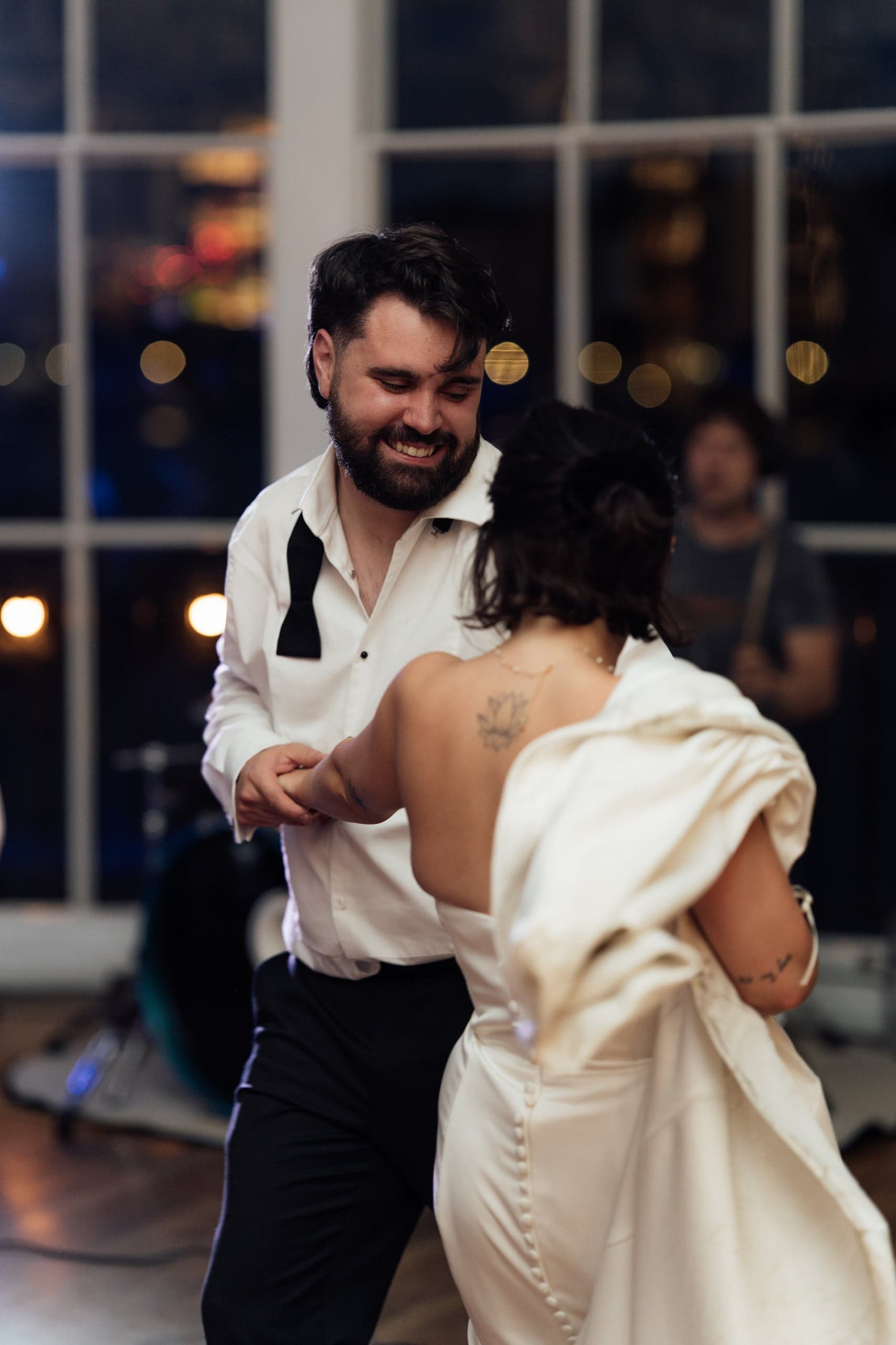 Bride and groom Kirsty and Jamie dancing together during their wedding celebration