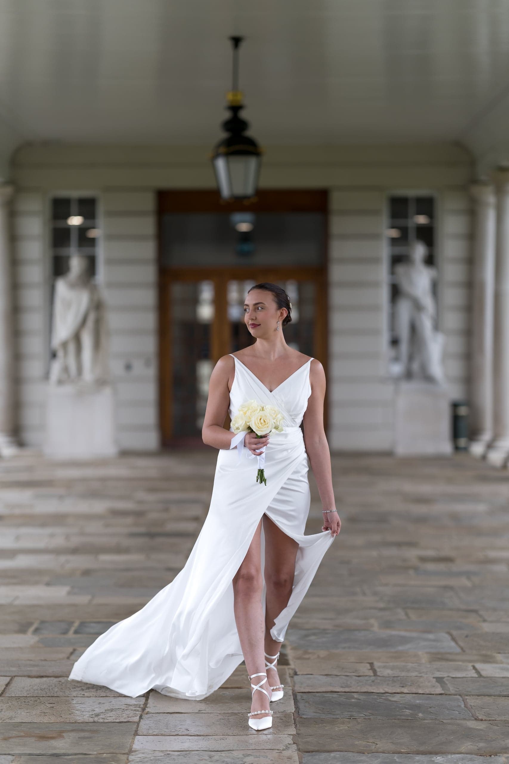 Bride laughing with bouquet at Greenwich wedding