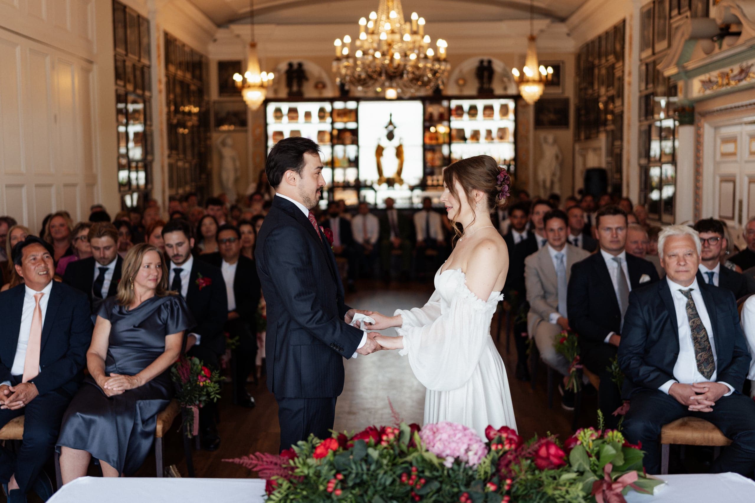 Sarah and Teddy sharing their first kiss during their Trafalgar Tavern wedding ceremony in Greenwich