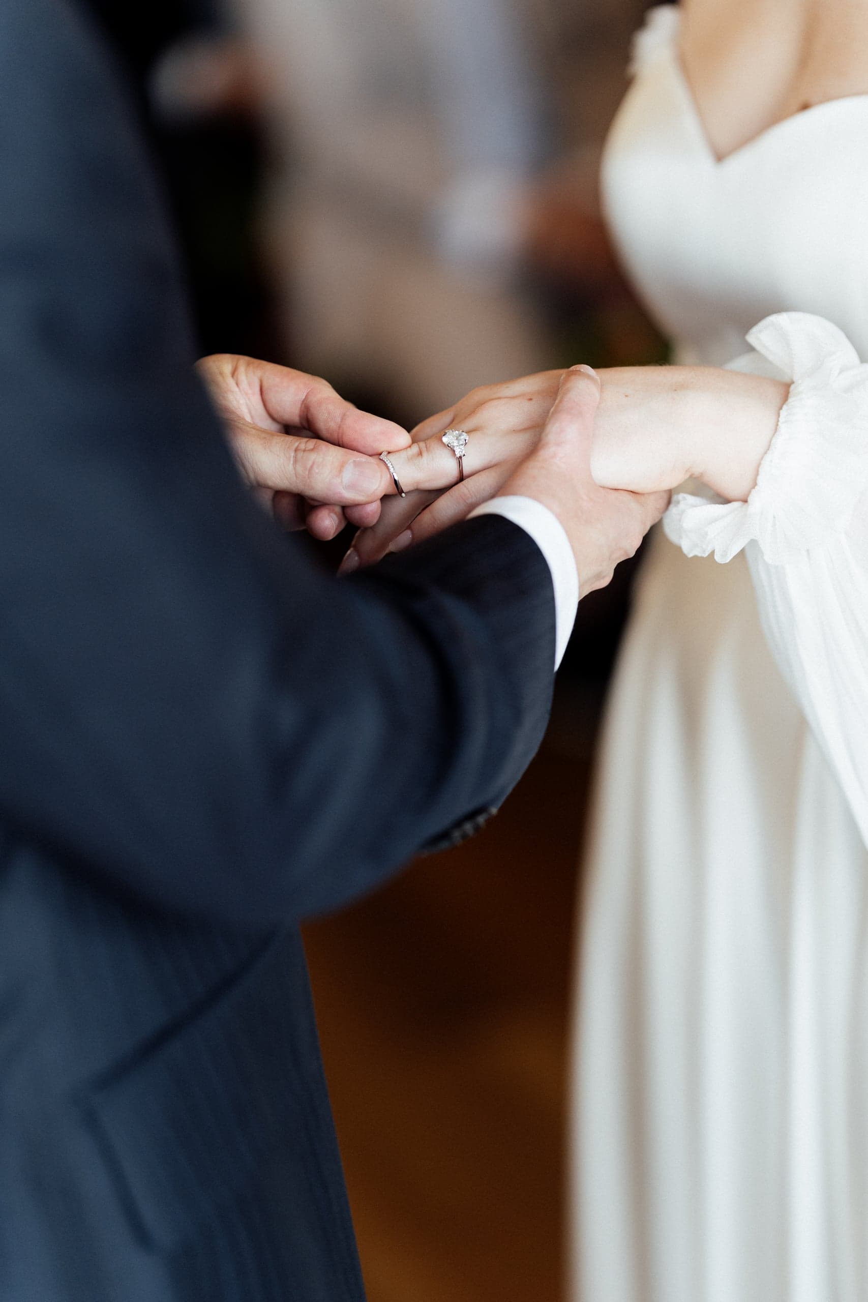 Wedding Ceremony Detail Shot of Bride's Hand with Ring on Finger