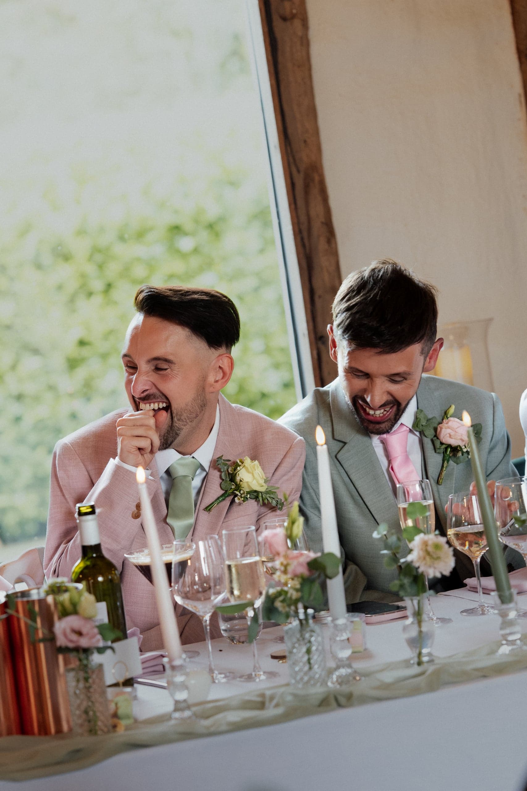 Guests reacting during the speeches at Ronnie and Danny's wedding
